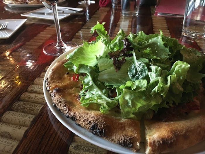 Pizza covered in greens from La Volata